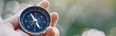 Person holding a compass