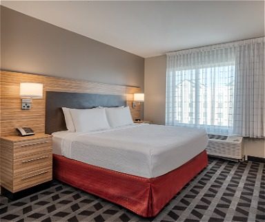 Hotel guest room with queen bed